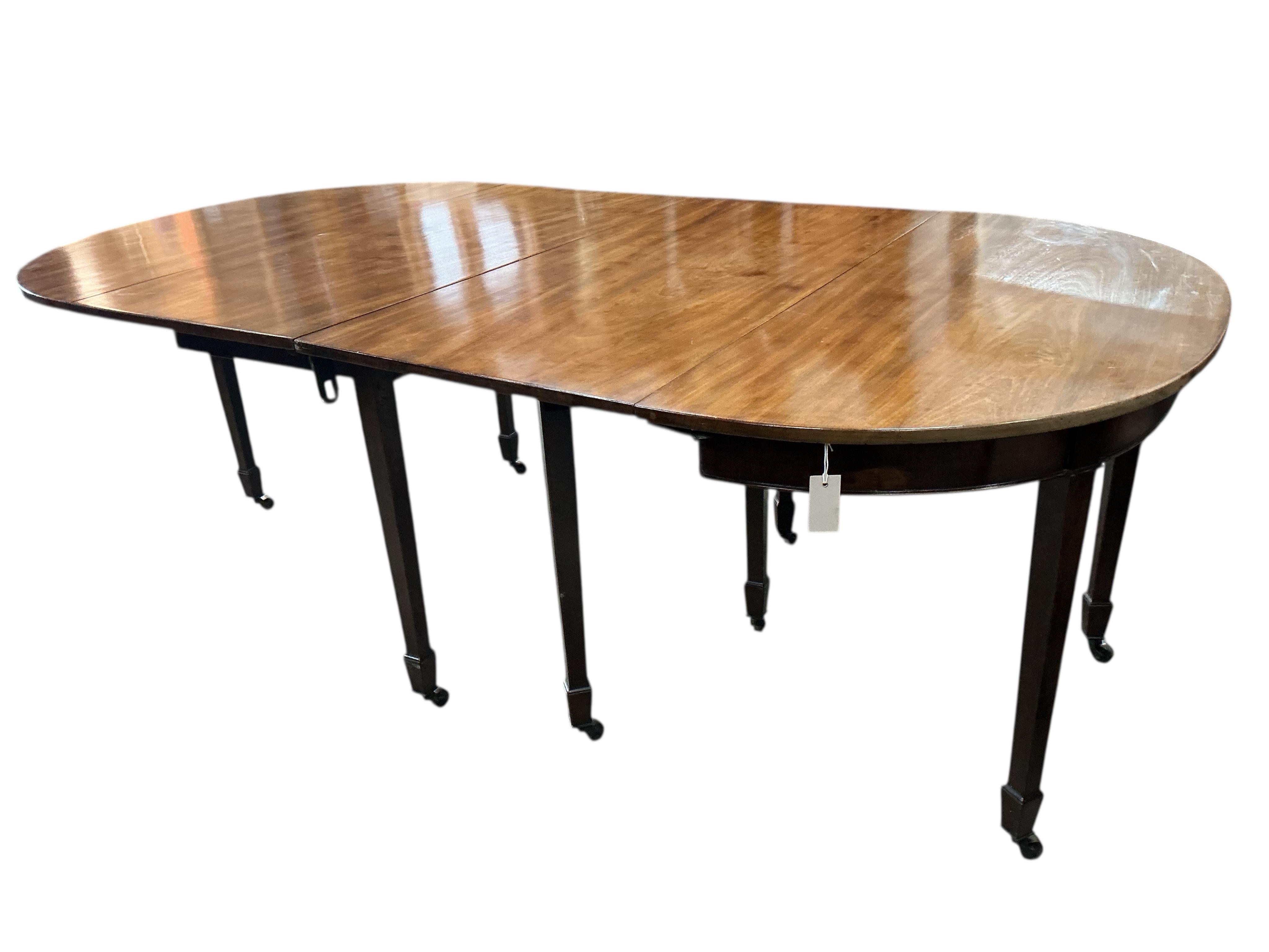 A George III and later mahogany D end extending dining table, width 217cm extended, one spare leaf, depth 122cm, height 76cm